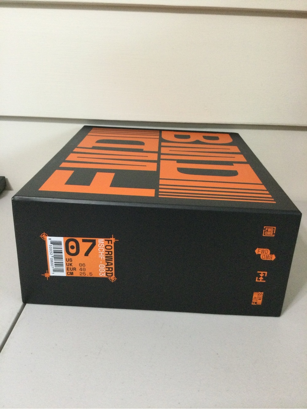 MSCHF Black and Orange Shoe Box with Bold Typography